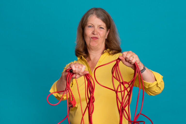 Almuth Fricke holds red cables in her hands