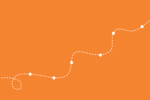 Eine gepunktete weiße Linien auf orangefarbenem Hintergrund